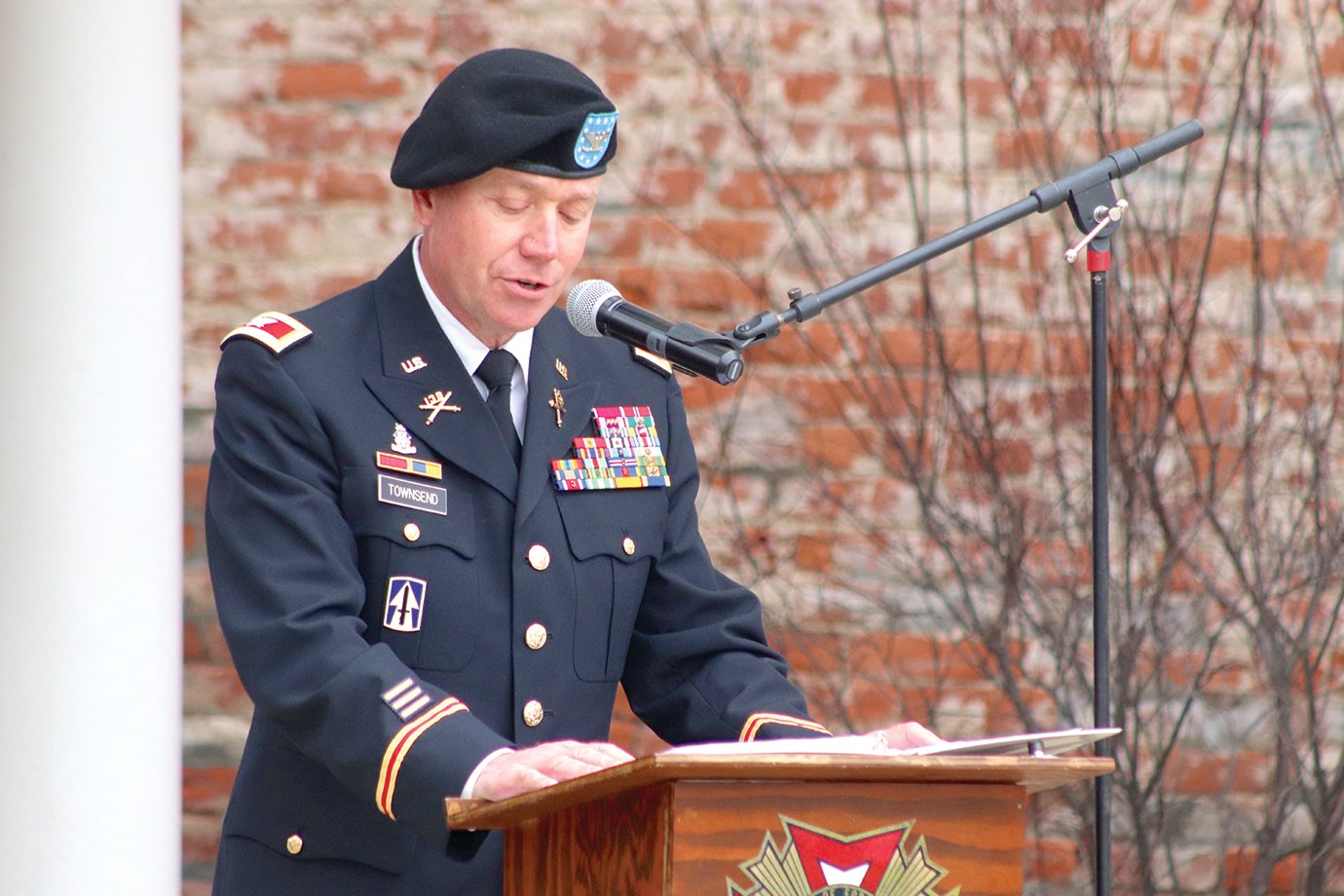 Col. Todd Townsend speaks of his time in Iraq and various other locations as he remembers his service and the soldiers who served with him; the colonel represented tens of thousands of America's military veterans Wednesday at Canine Plaza during an annual Veterans Day ceremony.